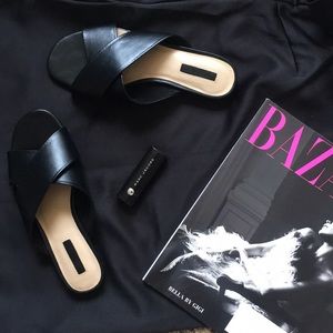 Like new black cross faux leather slippers size 6